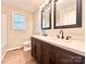 Stylish bathroom featuring a double vanity with dark wood cabinets and modern fixtures at 1905 26Th Ne St, Hickory, NC 28681