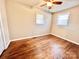 Bedroom with hardwood floors, ceiling fan, and two windows providing natural light at 1905 26Th Ne St, Hickory, NC 28681