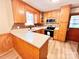 Well-lit kitchen features granite countertops, stainless steel appliances, and wood cabinetry at 1905 26Th Ne St, Hickory, NC 28681