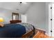 Cozy bedroom offering a comfortable bed, hardwood floors, and ample natural light at 307 Tara Elizabeth Pl # 22, Kannapolis, NC 28083