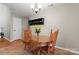 Charming dining area featuring a round glass-top table, wooden chairs, and stylish decor at 307 Tara Elizabeth Pl # 22, Kannapolis, NC 28083