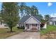 Charming home with stone accents, front porch with seating, and a lovely yard at 307 Tara Elizabeth Pl # 22, Kannapolis, NC 28083