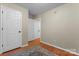 Hallway with hardwood floors, neutral paint, and multiple doorways leading to other areas of the house at 307 Tara Elizabeth Pl # 22, Kannapolis, NC 28083