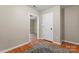 Inviting hallway featuring hardwood floors, neutral walls, and doorways to adjacent rooms at 307 Tara Elizabeth Pl # 22, Kannapolis, NC 28083