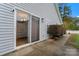 Outdoor patio area featuring siding, a sliding glass door, and a small bush, ideal for relaxation at 307 Tara Elizabeth Pl # 22, Kannapolis, NC 28083