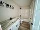 Clean bathroom featuring a bathtub, vanity with granite countertop and black matte fixtures at 3537 Taxahaw Rd, Lancaster, SC 29720