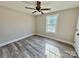 Bright bedroom with ceiling fan and vinyl plank flooring at 3537 Taxahaw Rd, Lancaster, SC 29720