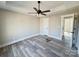 Primary bedroom with vinyl flooring and ceiling fan at 3537 Taxahaw Rd, Lancaster, SC 29720