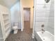 Modern bathroom with a tub, shower, and hexagon tile at 405 19Th Avenue Nw Cir, Hickory, NC 28601