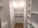 Spacious closet with built-in shelving and hanging rods at 405 19Th Avenue Nw Cir, Hickory, NC 28601