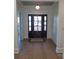 Light and bright entryway with hardwood floors and a view into the living room at 405 19Th Avenue Nw Cir, Hickory, NC 28601