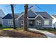 Gray brick and board and batten home with landscaped yard at 405 19Th Avenue Nw Cir, Hickory, NC 28601