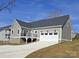 Gray house with white trim, two-car garage, and a deck at 405 19Th Avenue Nw Cir, Hickory, NC 28601