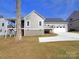 Gray house with white trim, two-car garage, and a deck at 405 19Th Avenue Nw Cir, Hickory, NC 28601