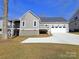 Gray house with white trim, two-car garage, and a deck at 405 19Th Avenue Nw Cir, Hickory, NC 28601