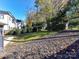 Spacious backyard with mature trees and a partially fenced perimeter at 716 Ellsworth Rd, Charlotte, NC 28211