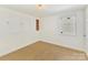 Spacious bedroom with built-in shelving and hardwood floors at 716 Ellsworth Rd, Charlotte, NC 28211