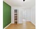 Bedroom with hardwood floors, closet, and access to bathroom at 716 Ellsworth Rd, Charlotte, NC 28211