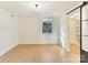 Bright bedroom with hardwood floors and built-in shelving at 716 Ellsworth Rd, Charlotte, NC 28211