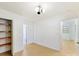 Bedroom with hardwood floors, an accent wall, and built-in shelving at 716 Ellsworth Rd, Charlotte, NC 28211