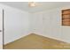 Bright bedroom with hardwood floors and wainscoting at 716 Ellsworth Rd, Charlotte, NC 28211