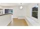 Well-lit dining area with built-in window seat and hardwood floors at 716 Ellsworth Rd, Charlotte, NC 28211