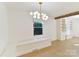 Bright dining area with built-in window seat and hardwood floors at 716 Ellsworth Rd, Charlotte, NC 28211