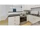 Modern kitchen features stainless steel appliances and granite countertops at 716 Ellsworth Rd, Charlotte, NC 28211