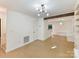 Spacious living area featuring built-in shelving and hardwood floors at 716 Ellsworth Rd, Charlotte, NC 28211