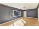 Bright living room with hardwood floors and dark walls at 716 Ellsworth Rd, Charlotte, NC 28211