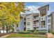 Multi-story condo building with blue and tan siding, multiple balconies, and lakeside views at 907 Southwest Dr, Davidson, NC 28036