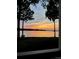 Stunning sunset view over serene lake from lakeside property at 907 Southwest Dr, Davidson, NC 28036