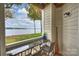 Covered patio with granite bar and view of the lake at 907 Southwest Dr, Davidson, NC 28036
