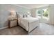 Serene main bedroom with soft lighting, neutral colors, and elegant furnishings at 111 Sentinel Ct, Mooresville, NC 28115