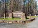 Entrance to Lake Norman State Park with sign, stone pillars, retaining wall, and pine trees in the background at 111 Sentinel Ct, Mooresville, NC 28115