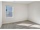 Spacious bedroom with grey carpet and window at 1345 31St Ne St, Conover, NC 28613