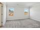 Bedroom with grey carpet and two windows at 1345 31St Ne St, Conover, NC 28613