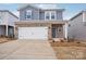 Two-story house with gray siding, brick accents, and a two-car garage at 1345 31St Ne St, Conover, NC 28613