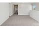 Long hallway with carpet and doors to bedrooms at 1345 31St Ne St, Conover, NC 28613