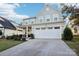 Two-story house with gray siding, white garage door, and landscaping at 1356 Augustus Beamon Dr, Indian Trail, NC 28079