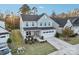 Two-story house with gray siding, red door, and a two-car garage at 1356 Augustus Beamon Dr, Indian Trail, NC 28079