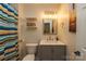 Clean bathroom featuring a gray vanity and striped shower curtain at 140 Rock Ridge Ln, Mount Holly, NC 28120