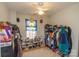 Cozy bedroom with a window, clothing racks, and storage at 140 Rock Ridge Ln, Mount Holly, NC 28120