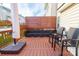 Relaxing deck features comfy seating and privacy screen at 140 Rock Ridge Ln, Mount Holly, NC 28120