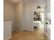 Upstairs hallway offering a view into a bedroom with hat decor at 140 Rock Ridge Ln, Mount Holly, NC 28120