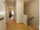 Hallway with carpet flooring and access to bedrooms at 140 Rock Ridge Ln, Mount Holly, NC 28120