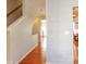 Hallway with hardwood floors and view into living area at 140 Rock Ridge Ln, Mount Holly, NC 28120