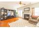 Bright living room with fireplace, hardwood floors, and access to backyard at 140 Rock Ridge Ln, Mount Holly, NC 28120