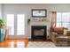 Cozy living room featuring a fireplace and hardwood floors at 140 Rock Ridge Ln, Mount Holly, NC 28120