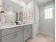 Bathroom featuring dual sinks, gray cabinets, and a neutral color palette at 148 Shepherds Landing Dr, Mooresville, NC 28115